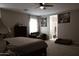 Spacious primary bedroom with a ceiling fan and lots of natural light at 30893 W Pinchot W Ct, Buckeye, AZ 85396