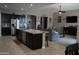 Open kitchen with island and stainless steel appliances at 30893 W Pinchot W Ct, Buckeye, AZ 85396