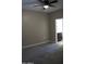 Well-lit bedroom with ceiling fan and neutral carpeting at 30893 W Pinchot W Ct, Buckeye, AZ 85396