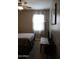 Bedroom with queen bed, ceiling fan, and window at 30893 W Pinchot W Ct, Buckeye, AZ 85396