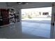 Bright garage with epoxy flooring, ample storage, and view of neighborhood at 30893 W Pinchot W Ct, Buckeye, AZ 85396
