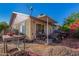 Backyard with a covered patio, grill, and desert landscaping at 2029 S Las Palmas --, Mesa, AZ 85202