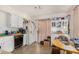 Kitchen with white cabinets, appliances, and dining area at 2029 S Las Palmas --, Mesa, AZ 85202