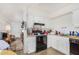 Kitchen boasts white cabinets and black appliances at 2029 S Las Palmas --, Mesa, AZ 85202