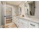 Bathroom features double sinks, marble countertop, and a view into bedroom and shower at 3410 N 45Th Pl, Phoenix, AZ 85018