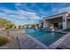 Luxury backyard oasis featuring a stunning pool, spa, and spacious patio at 11250 W Prospector Dr, Queen Creek, AZ 85144