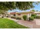 View of the building's exterior, showcasing landscaping and walkway at 641 S Power Rd # 364, Mesa, AZ 85206