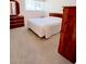 Bright bedroom featuring a queen-size bed and wood dresser at 641 S Power Rd # 364, Mesa, AZ 85206