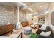 Living room with stone fireplace and modern furniture at 5215 E Lafayette Blvd, Phoenix, AZ 85018