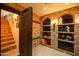 Walk-in wine cellar; brick walls, wooden door, and extensive shelving at 118 E Palm Ln, Phoenix, AZ 85004