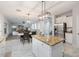 Granite kitchen island with seating, open to the living area at 15163 W Cameron Dr, Surprise, AZ 85379