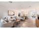Open living space with modern furniture and wood floors at 15163 W Cameron Dr, Surprise, AZ 85379