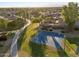 Aerial view of neighborhood featuring a park, basketball court, and houses at 15163 W Cameron Dr, Surprise, AZ 85379