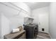 Laundry room with washer, dryer and shelving at 15163 W Cameron Dr, Surprise, AZ 85379