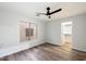Well-lit bedroom with wood floors and a walk-in closet at 15163 W Cameron Dr, Surprise, AZ 85379