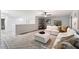 Spacious loft with sectional sofa and built-in shelving at 15163 W Cameron Dr, Surprise, AZ 85379