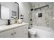 Elegant bathroom with marble tile and modern fixtures at 15163 W Cameron Dr, Surprise, AZ 85379