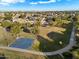 Aerial view showing a community with a park, playground, and basketball court at 15163 W Cameron Dr, Surprise, AZ 85379
