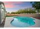 Inviting kidney shaped pool in backyard at 15163 W Cameron Dr, Surprise, AZ 85379