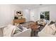 Spacious living room featuring a neutral color palette and stylish decor at 15163 W Cameron Dr, Surprise, AZ 85379