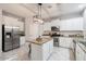 Modern kitchen with white cabinets, granite counters at 15163 W Cameron Dr, Surprise, AZ 85379