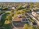 Arial view of neighborhood amenities including a park, playground, basketball court, and homes at 15163 W Cameron Dr, Surprise, AZ 85379