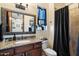 Bathroom with granite countertop and a black shower curtain at 1356 E Loveland Ln, San Tan Valley, AZ 85140