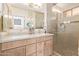 Elegant bathroom with dual sinks, a large shower, and modern fixtures at 3047 E Fremont Rd, Phoenix, AZ 85042