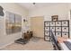 Bright home office with window, built in shelving and sliding doors at 3047 E Fremont Rd, Phoenix, AZ 85042