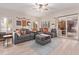 Spacious living room with gray sectional sofa and wood floors at 3047 E Fremont Rd, Phoenix, AZ 85042