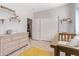 Bedroom with crib, dresser, and plenty of storage space at 3047 E Fremont Rd, Phoenix, AZ 85042