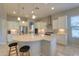 Spacious kitchen with island, stainless steel appliances, and white cabinetry at 27552 W Tonopah Dr, Buckeye, AZ 85396