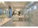 Elegant bathroom with double vanity, large walk-in shower, and lots of light at 27552 W Tonopah Dr, Buckeye, AZ 85396