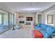 Bright living room with fireplace, comfortable seating, and access to patio at 27552 W Tonopah Dr, Buckeye, AZ 85396