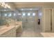 Walk-in shower with seamless glass enclosure and modern tile at 27552 W Tonopah Dr, Buckeye, AZ 85396