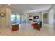 Open living room with fireplace and sliding glass doors to backyard at 27552 W Tonopah Dr, Buckeye, AZ 85396