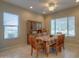 Bright dining area with wood table and chairs, and built-in hutch at 27552 W Tonopah Dr, Buckeye, AZ 85396
