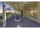 Covered patio with fire pit, perfect for outdoor entertaining at 27552 W Tonopah Dr, Buckeye, AZ 85396