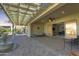 Covered patio with seating area, string lights, and a water fountain at 27552 W Tonopah Dr, Buckeye, AZ 85396