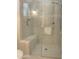 Walk-in shower with glass enclosure and tile surround at 27552 W Tonopah Dr, Buckeye, AZ 85396