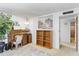 Home office with a roll top desk and built in shelving at 4019 E Calypso Ave, Mesa, AZ 85206