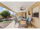 Outdoor patio featuring a dining area and ceiling fan at 4019 E Calypso Ave, Mesa, AZ 85206