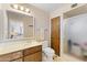 Bathroom with shower, toilet, and updated vanity at 4019 E Calypso Ave, Mesa, AZ 85206