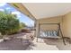 Relaxing patio with a swing and view of the backyard at 4019 E Calypso Ave, Mesa, AZ 85206