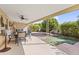 Covered patio with seating area and backyard access at 4019 E Calypso Ave, Mesa, AZ 85206