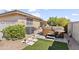 Backyard with hot tub and artificial turf at 4019 E Calypso Ave, Mesa, AZ 85206