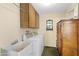 Laundry room with washer, dryer, and extra storage at 4019 E Calypso Ave, Mesa, AZ 85206