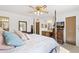 Main bedroom with a king-size bed and lots of natural light at 4019 E Calypso Ave, Mesa, AZ 85206