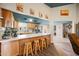 Kitchen features a breakfast bar and wooden cabinetry at 2330 S Gold Ore Ct, Apache Junction, AZ 85119