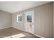 Bright sunroom features a door leading to the backyard and a window providing natural light at 2330 S Gold Ore Ct, Apache Junction, AZ 85119